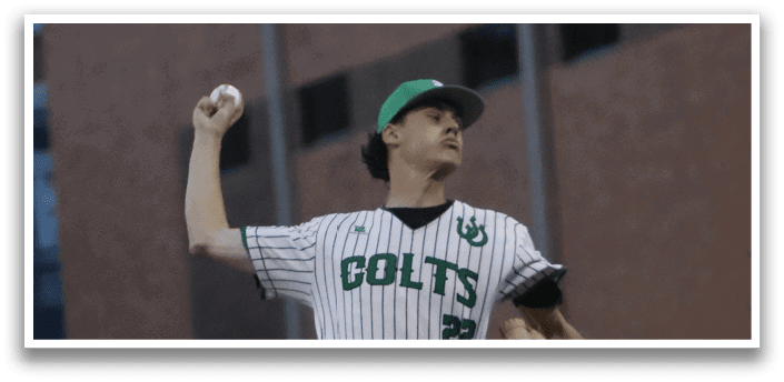 A baseball player in a green and white uniform is pitching a ball. Description generated by AI