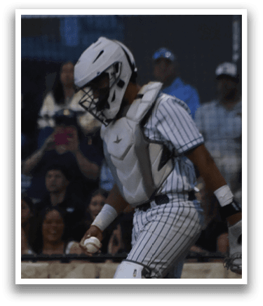 A baseball player is holding a bat and getting ready to swing. Description generated by AI
