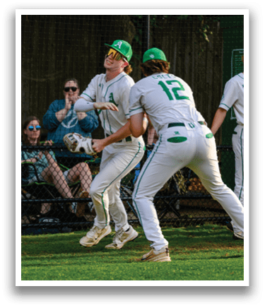 A baseball player catching a ball. Description generated by AI