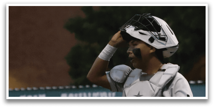 A baseball player wearing a white uniform and a helmet. Description generated by AI