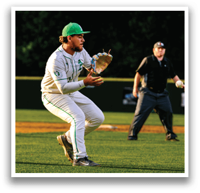 A baseball player catching a ball. Description generated by AI