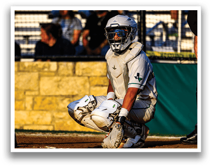 A baseball player wearing a white uniform and a helmet. Description generated by AI