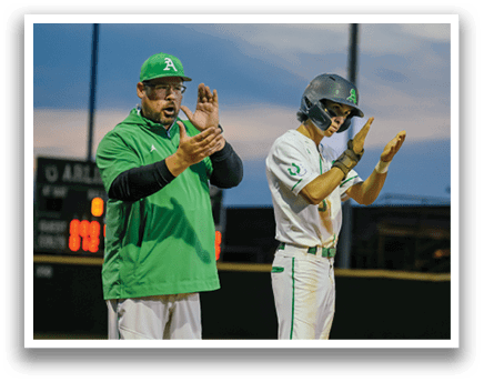 A man and a boy are standing on a baseball field. Description generated by AI