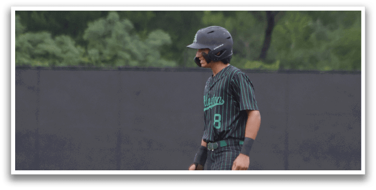 A baseball player wearing a green shirt and black pants. Description generated by AI