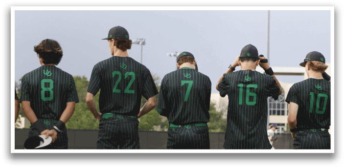 A group of people wearing green and black shirts. Description generated by AI