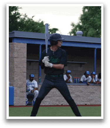 A baseball player in a green and black striped shirt and blue cap is swinging a bat. Description generated by AI