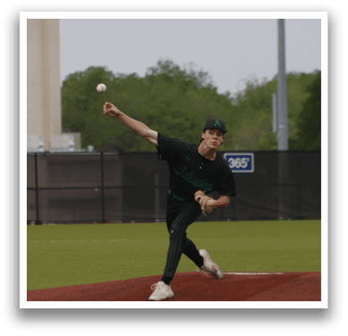 A baseball player in a green and white uniform is pitching a ball. Description generated by AI