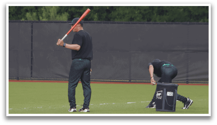 A man is swinging a bat at a ball. Description generated by AI