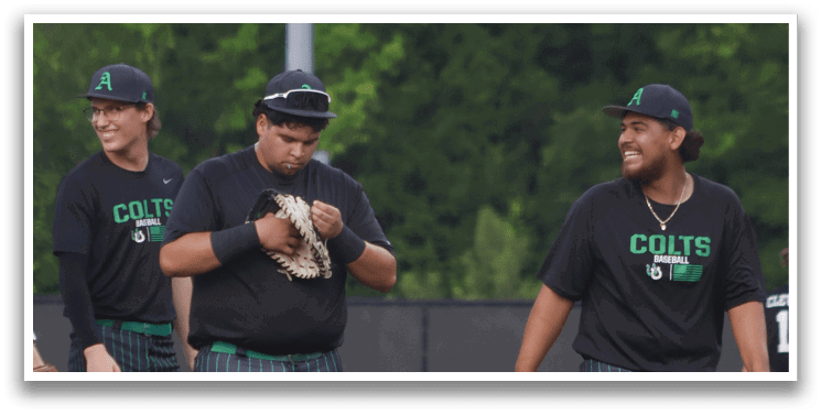 Three men wearing black shirts and green pants. Description generated by AI