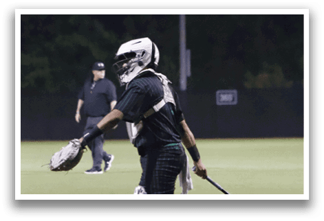 A baseball player is swinging a bat on a field. Description generated by AI
