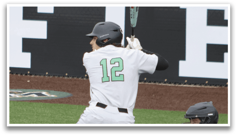 A baseball player is swinging a bat at a ball. Description generated by AI
