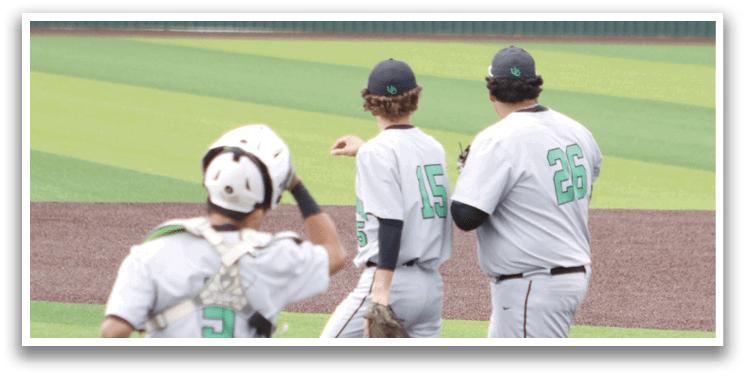 Three baseball players on a field. Description generated by AI