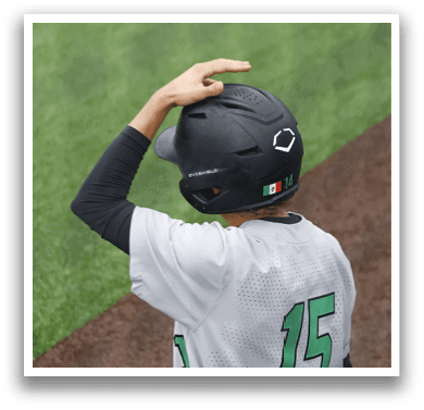 A baseball player wearing a green and white uniform. Description generated by AI