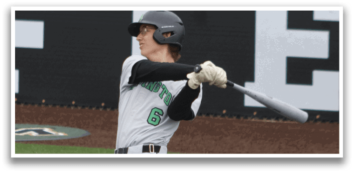 A baseball player wearing a green and black uniform with the number 8 on the back. Description generated by AI