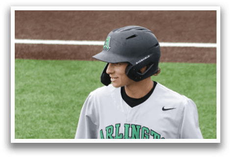 A baseball player wearing a grey and green jersey. Description generated by AI
