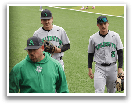 A group of baseball players standing on a field. Description generated by AI