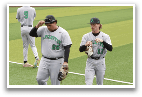 Two baseball players wearing gray uniforms. Description generated by AI