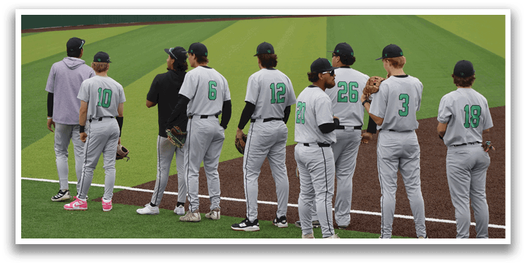 Baseball players standing on a field. Description generated by AI