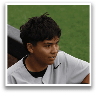 A baseball player wearing a gray jersey with the number 5 on it. Description generated by AI