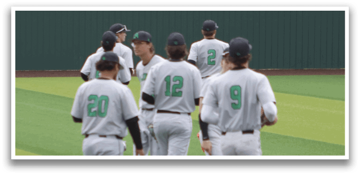 A group of baseball players walking off the field. Description generated by AI
