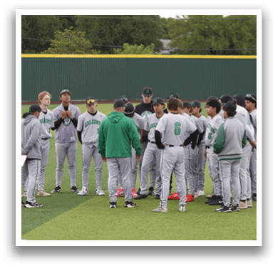 A group of baseball players standing on a field. Description generated by AI