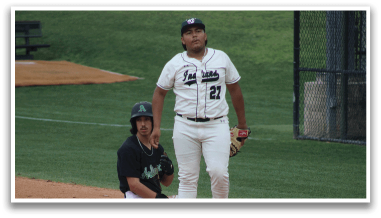 A baseball player is standing on the field. Description generated by AI