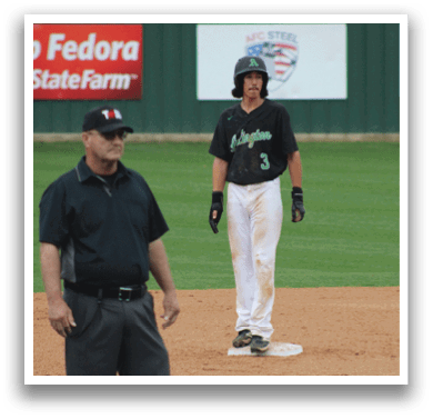 A baseball player wearing a black shirt and white pants. Description generated by AI