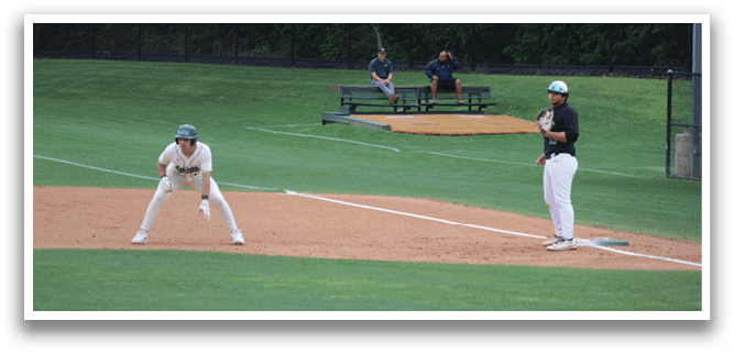 A baseball player is standing on the pitcher's mound. Description generated by AI