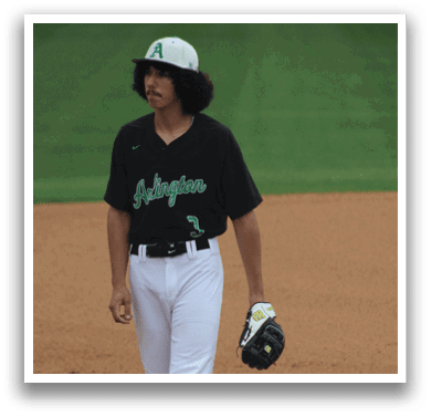 A baseball player wearing a black shirt and white pants. Description generated by AI