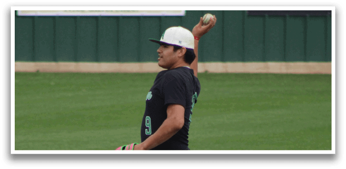 A man wearing a black shirt and white pants is throwing a baseball. Description generated by AI