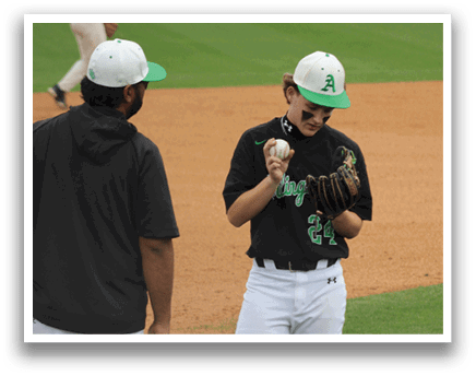 A baseball player wearing a green hat and a black shirt. Description generated by AI