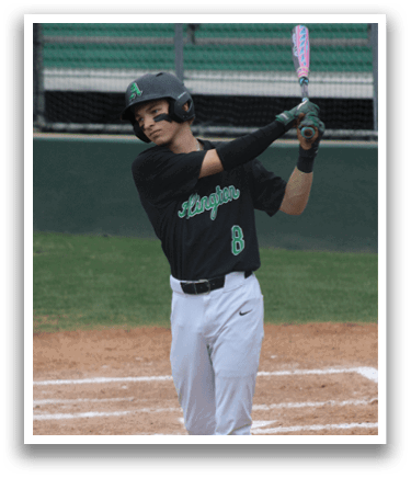 A baseball player in a black shirt and white pants holding a bat. Description generated by AI