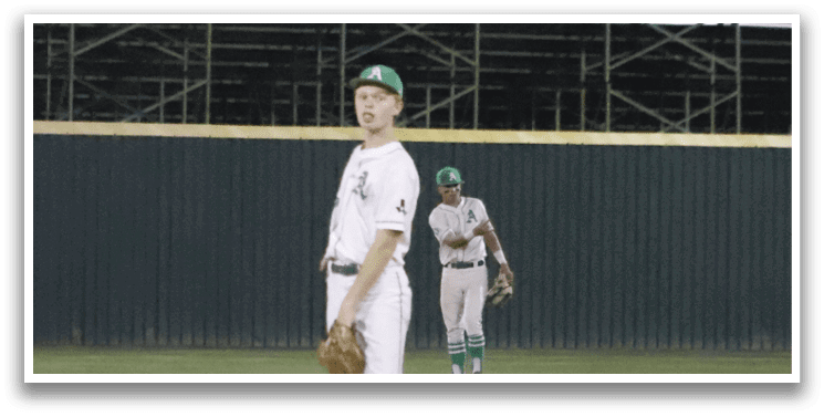 A baseball player standing on a field. Description generated by AI