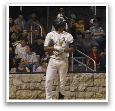 A baseball player standing on the field. Description generated by AI