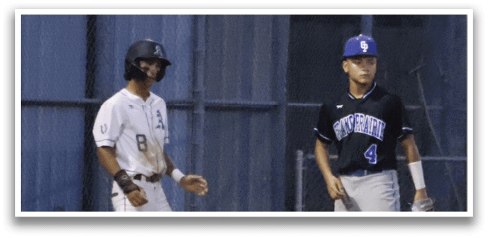 Two baseball players standing on a field. Description generated by AI