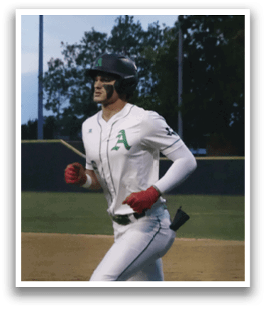 A baseball player wearing a green and white uniform. Description generated by AI
