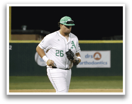 A baseball player wearing a green hat and white uniform. Description generated by AI