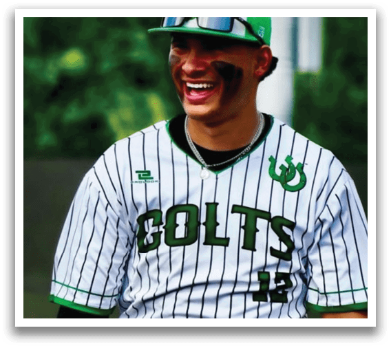 A baseball player wearing a green and white uniform. Description generated by AI