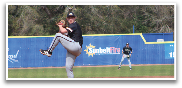 A baseball player in a black shirt and grey pants is pitching a ball on a field. AI generated content