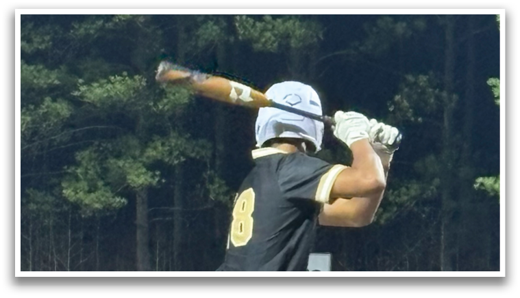 A baseball player in a black shirt and white pants is holding a bat and preparing to swing. AI generated content