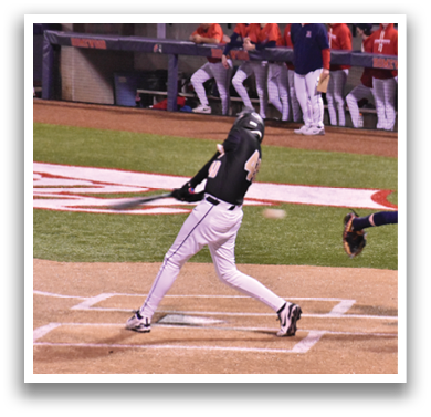 A baseball player is swinging a bat at a ball during a game. AI generated content