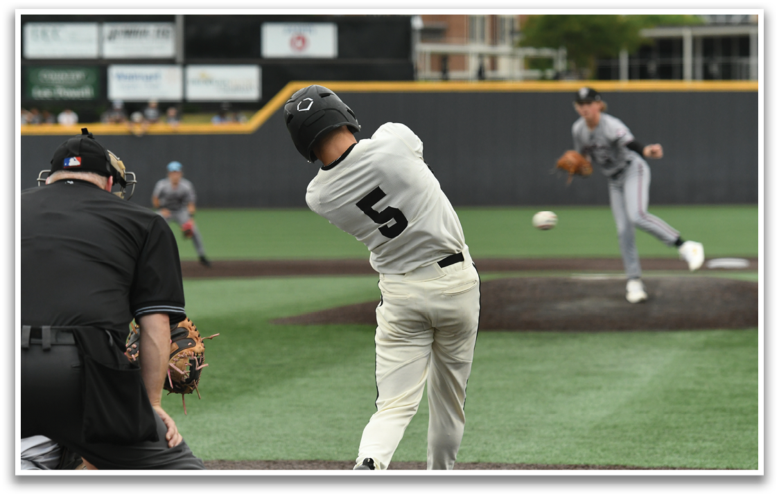 A baseball player is swinging a bat at a ball. Description generated by AI