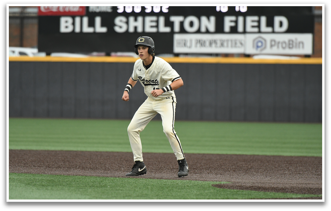 A baseball player wearing a helmet and white pants. Description generated by AI