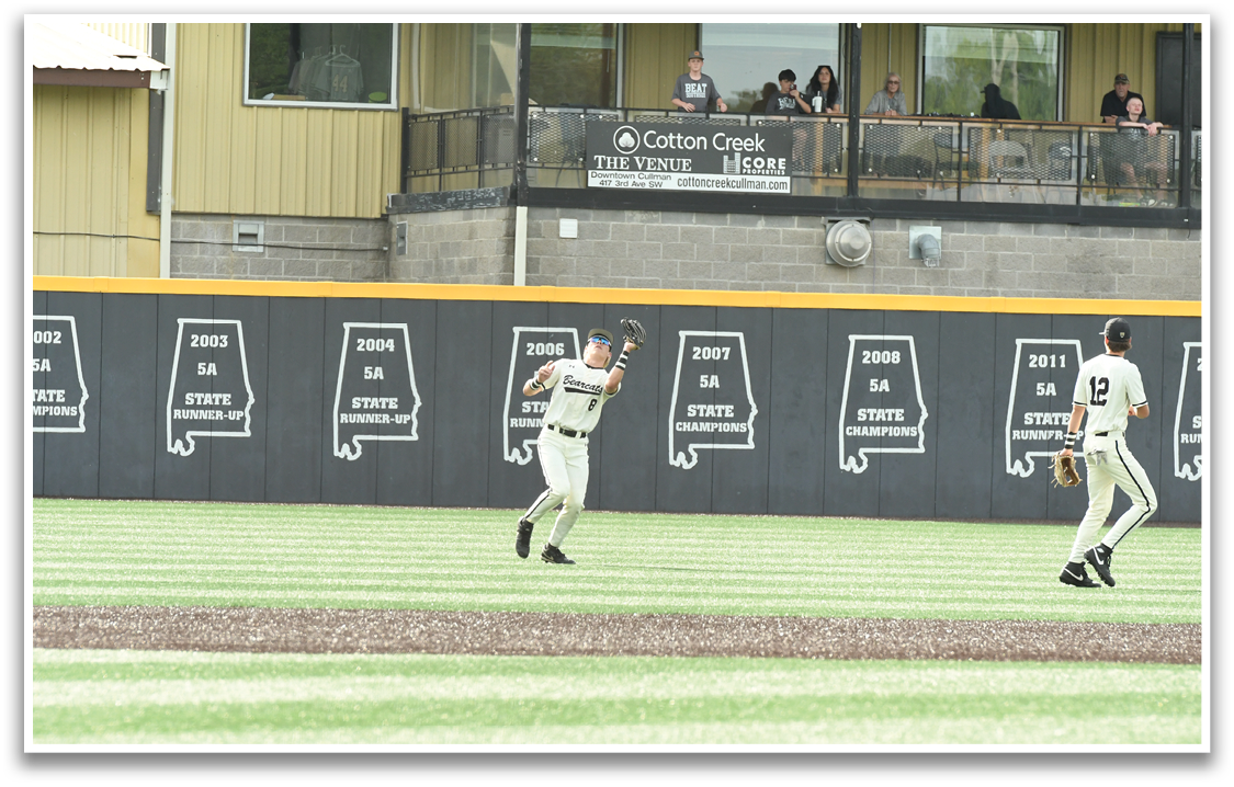 A baseball player in a white uniform is throwing a ball. Description generated by AI