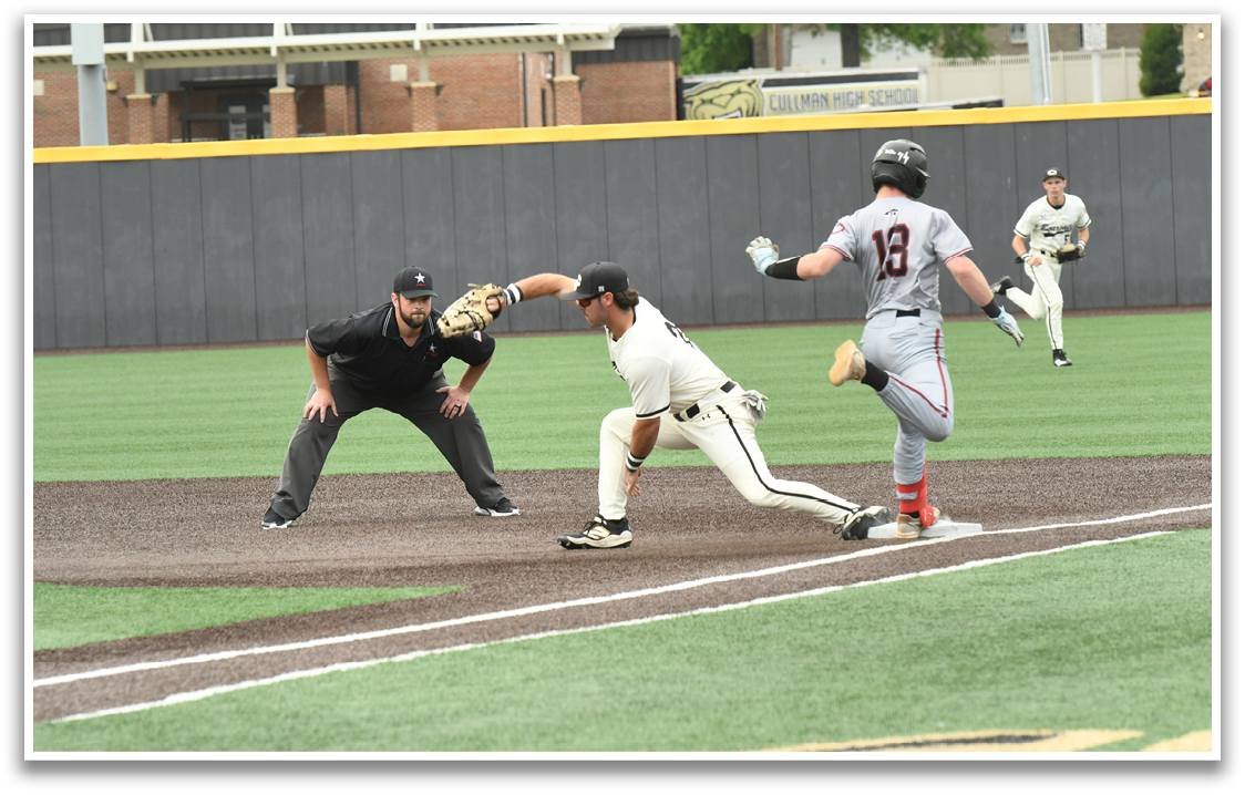 A baseball player is running to a base. Description generated by AI