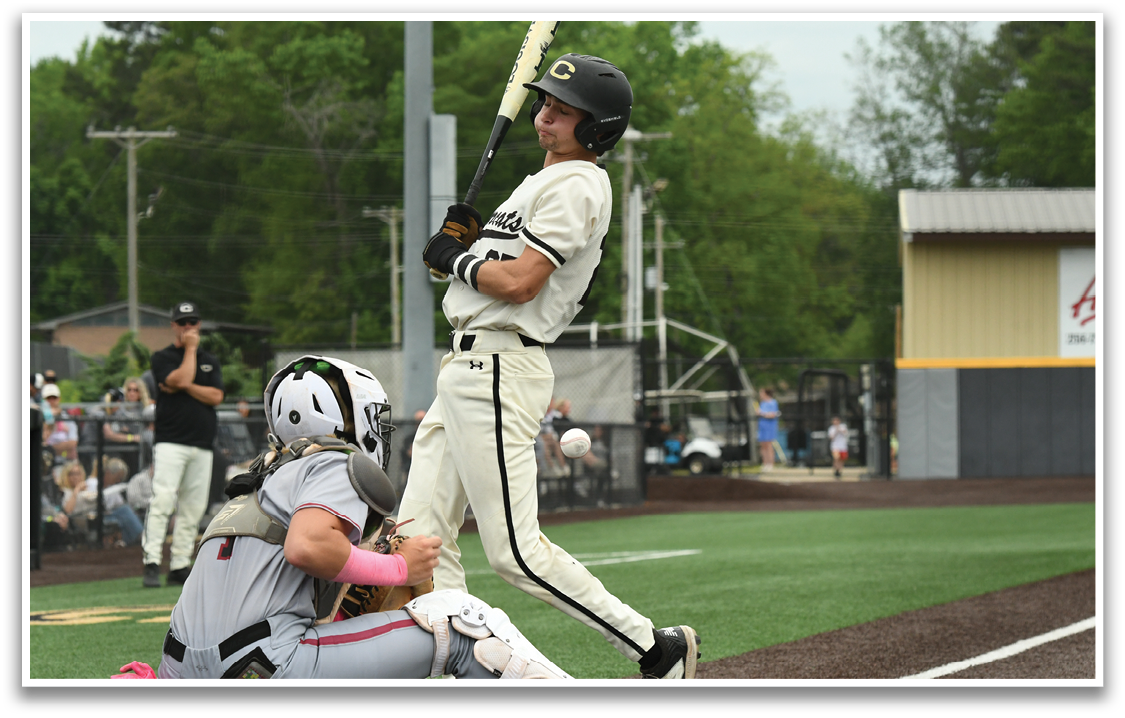 A baseball player is swinging a bat at a ball. Description generated by AI