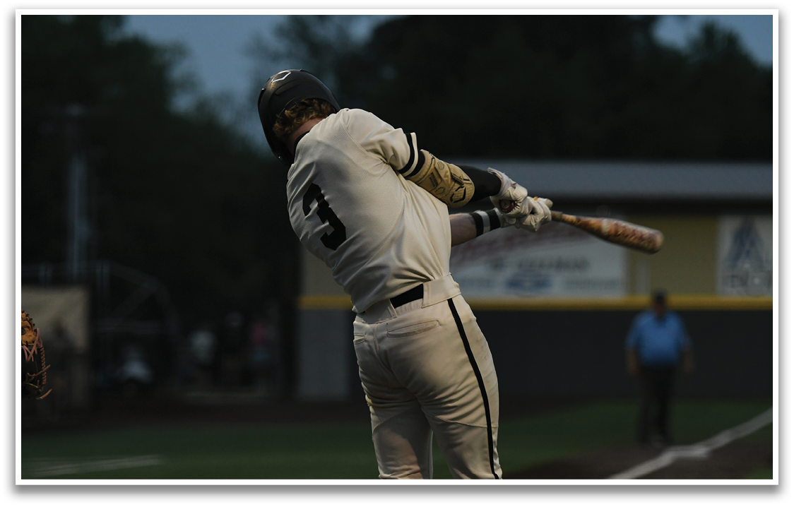 A baseball player is swinging a bat. Description generated by AI