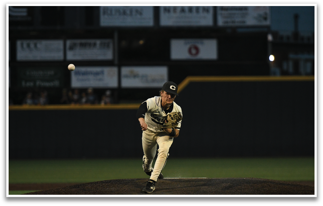A baseball player is pitching a ball. Description generated by AI