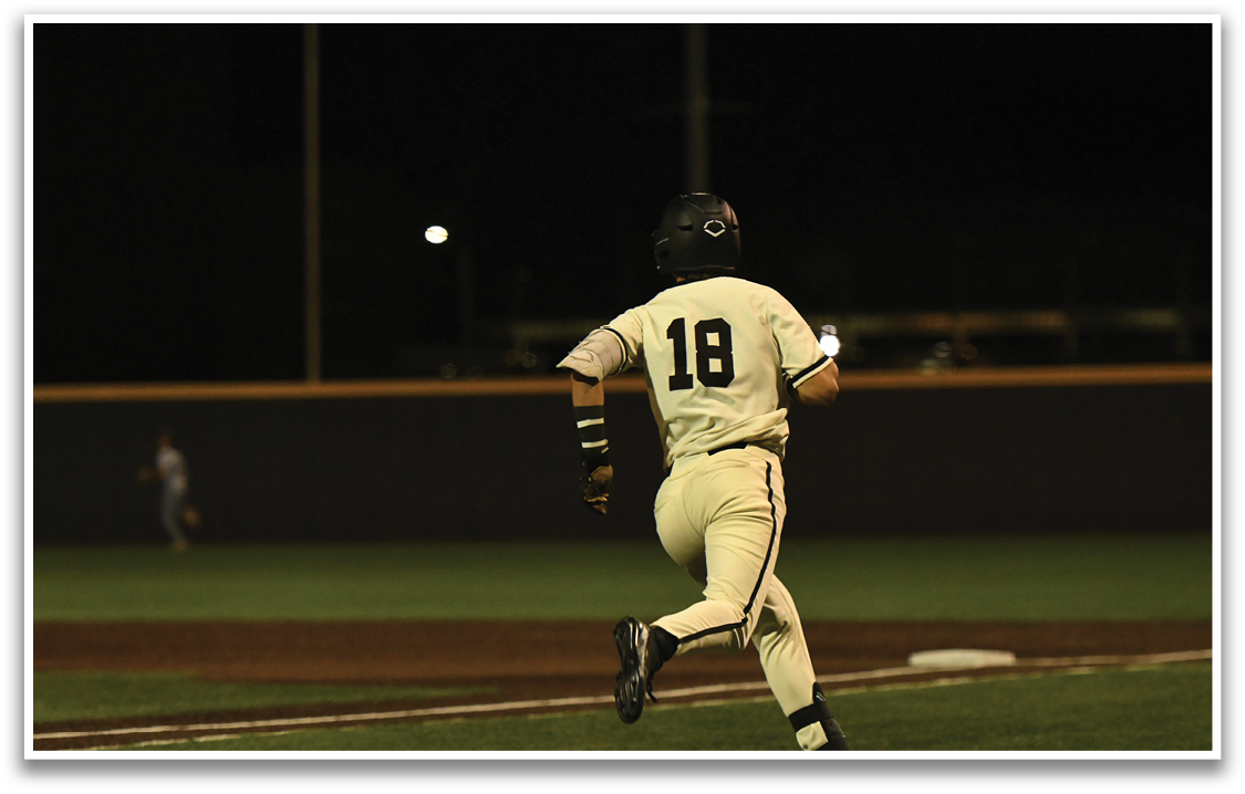 A baseball player running on the field. Description generated by AI