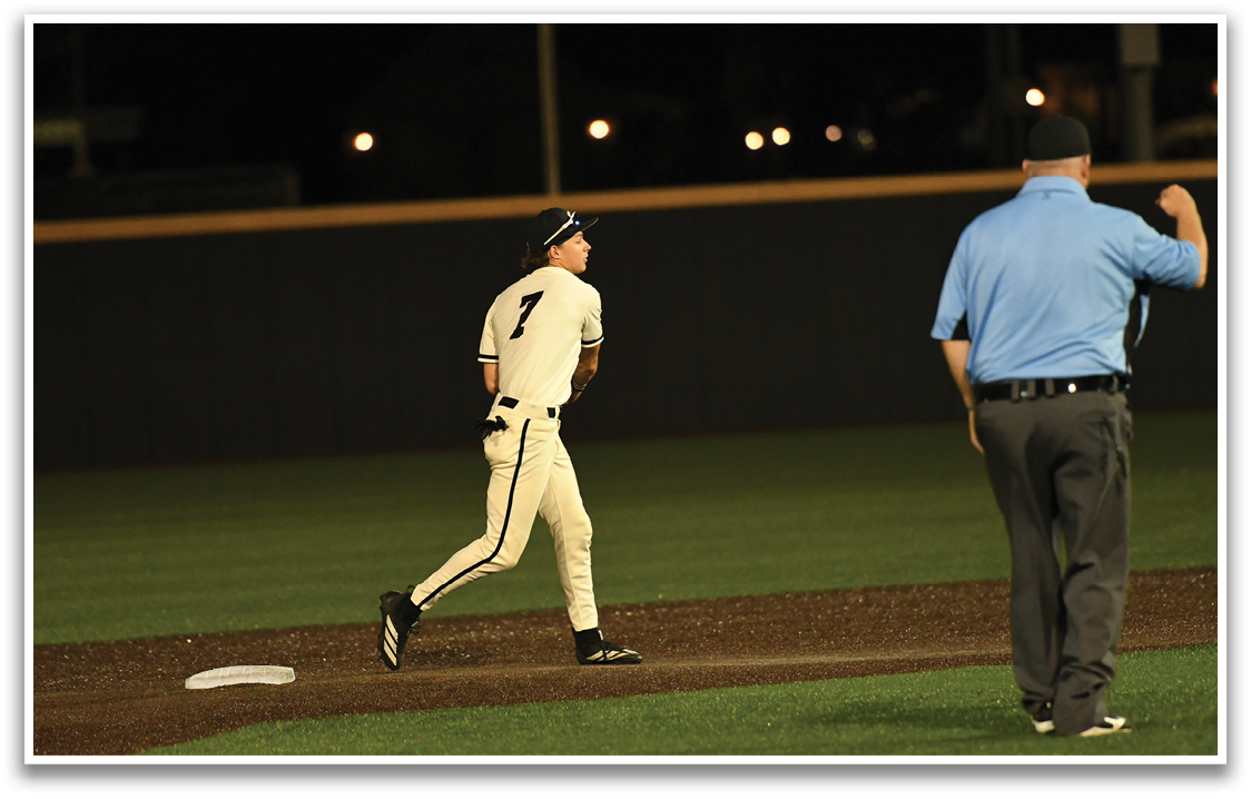 A baseball player wearing a number 7 jersey. Description generated by AI